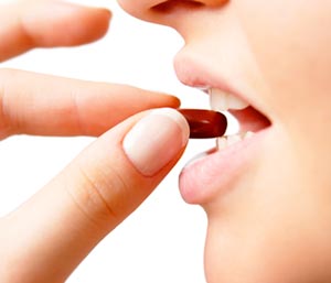 woman taking Garcinia Pill